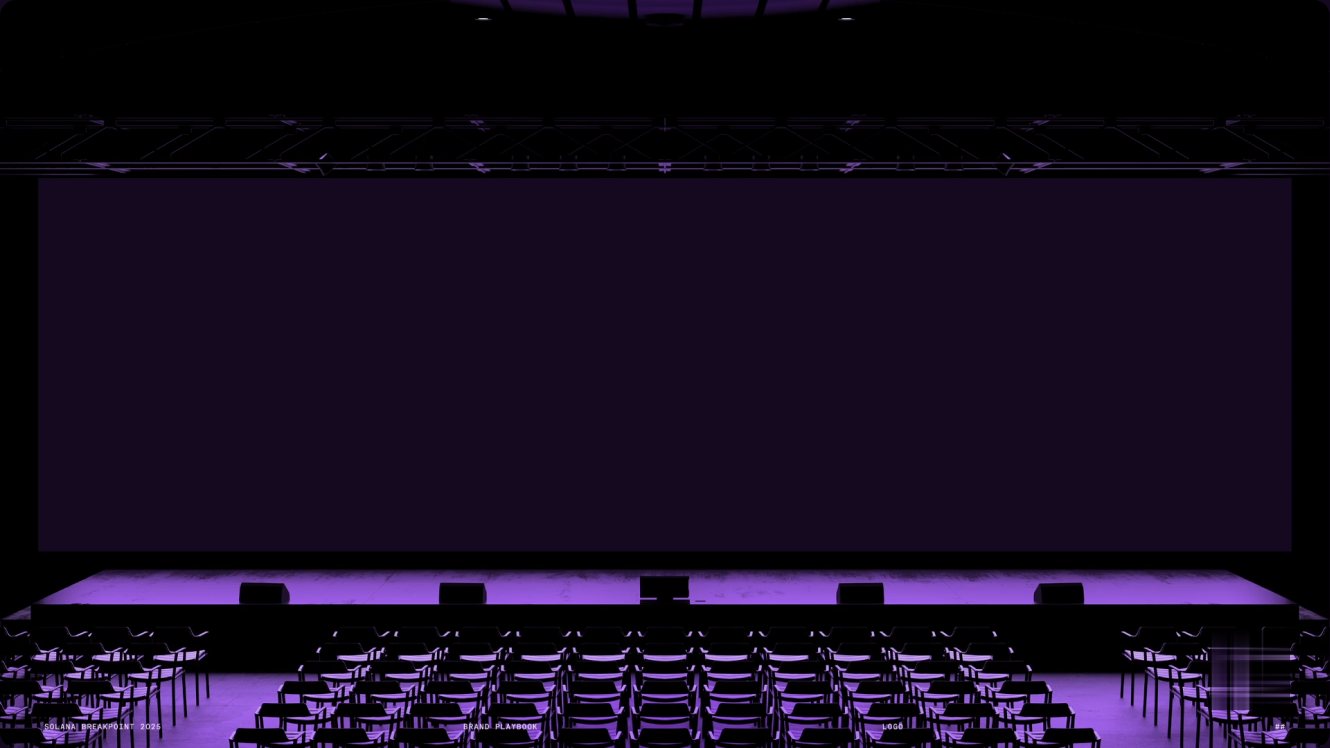 Breakpoint main stage lit in purple over rows of seating.