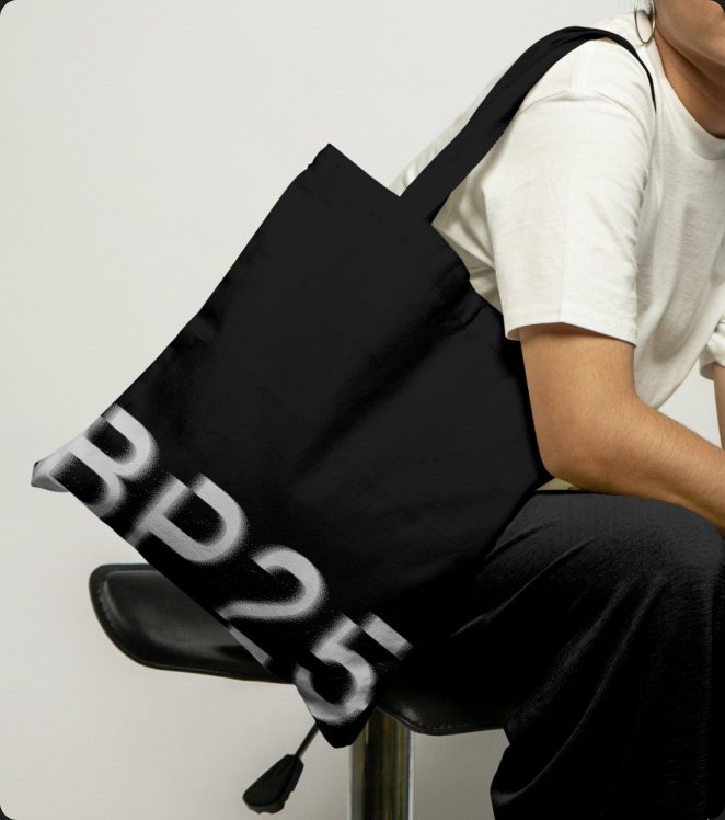 A black Breakpoint 2025 tote bag.